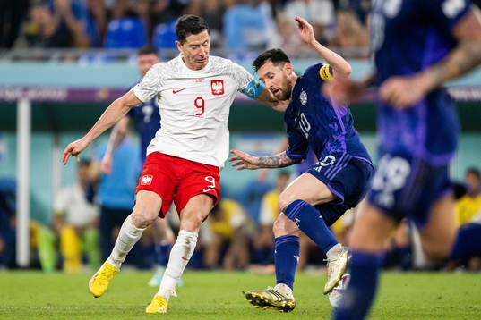 Robert Lewandowski of Poland and Lionel Messi of Argentina