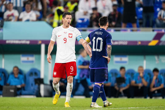 Robert Lewandowski of Poland and Lionel Messi of Argentina