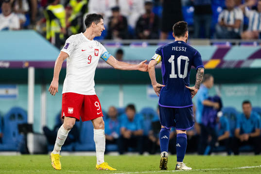 Robert Lewandowski of Poland and Lionel Messi of Argentina
