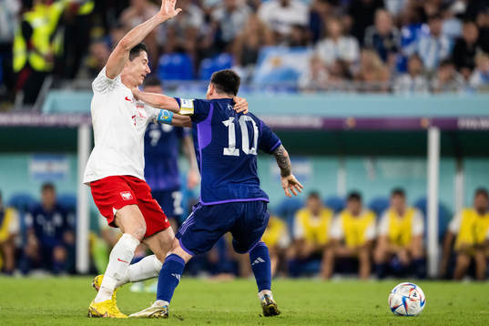 Robert Lewandowski of Poland and Lionel Messi of Argentina