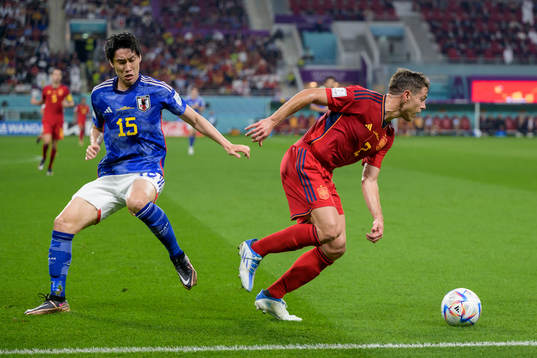 Daichi Kamada of Japan and Cesar Azpilicueta of Spain
