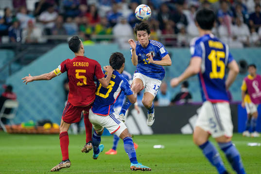 Sergio Busquets of Spain against Hidemasa Morita and Ao