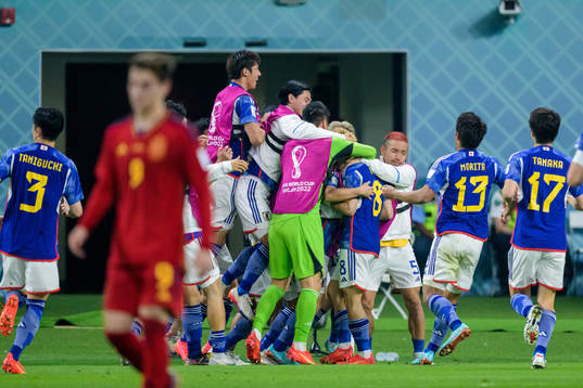 Ritsu Doan of Japan celebrate with teammates