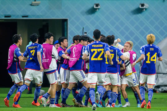 Ritsu Doan of Japan celebrate with teammates