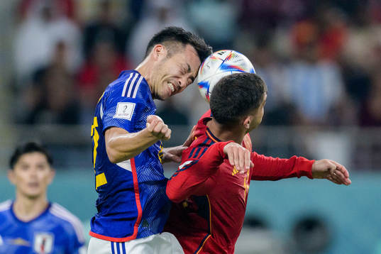 Maya Yoshida of Japan and Ferran Torres of Spain