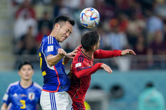 Maya Yoshida of Japan and Ferran Torres of Spain