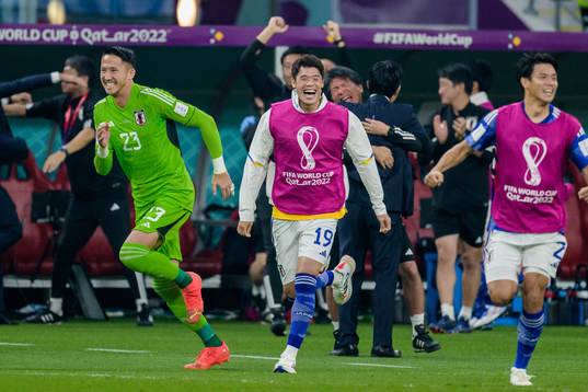 goalkeeper Daniel Schmidtand Hiroki Sakai of Japan celebrate