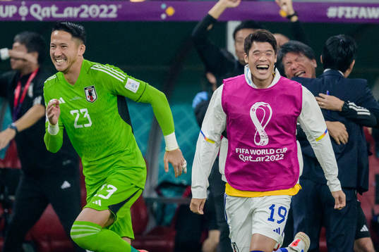 goalkeeper Daniel Schmidtand Hiroki Sakai of Japan celebrate