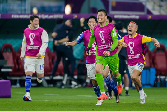 goalkeeper Eiji Kawashima of Japan celebrates