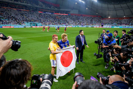 Yuto Nagatomo and Ritsu Doan of Japan celebrate