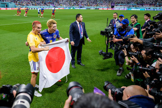 Yuto Nagatomo and Ritsu Doan of Japan celebrate