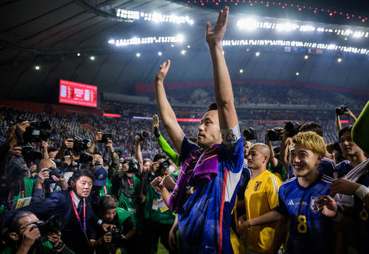 Maya Yoshida of Japan celebrates with the team