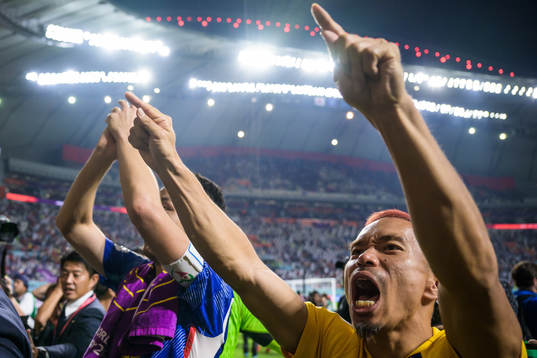 Yuto Nagatomo of Japan celebrates