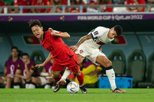 Jaesung Lee of South Korea and Joao Cancelo of Portugal