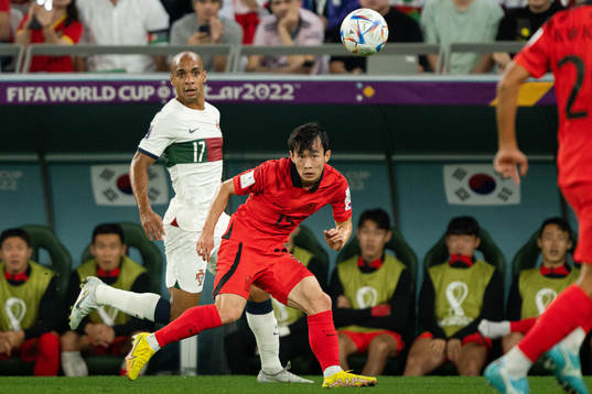 Joao Mario of Portugal and Moonhwan Kim of South Korea