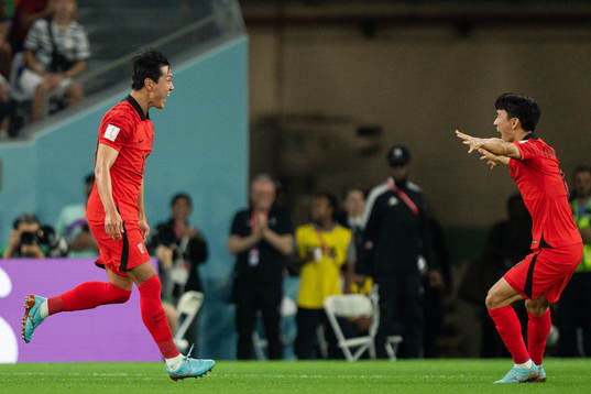 Younggwon Kim and Inbeom Hwang of South Korea celebrate the