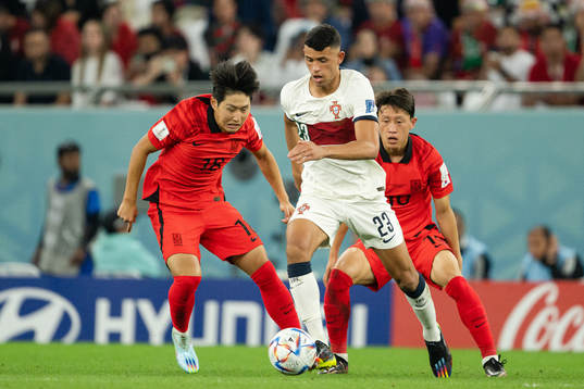 Kangin Lee and Jaesung Lee of South Korea against Matheus