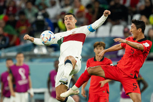 Cristiano Ronaldo of Portugal and Wooyoung Jung of South