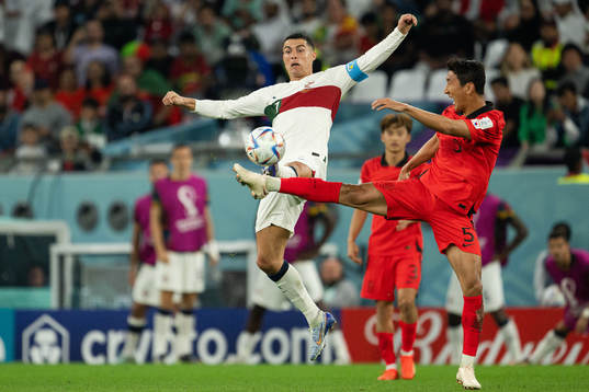 Cristiano Ronaldo of Portugal and Wooyoung Jung of South
