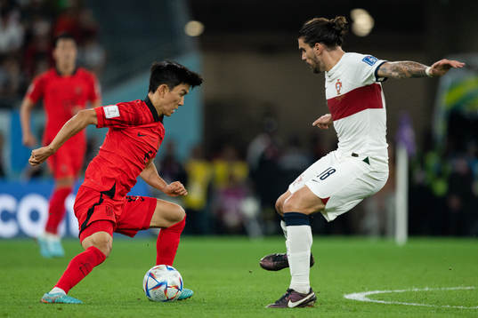 Inbeom Hwang of South Korea and Ruben Neves of Portugal