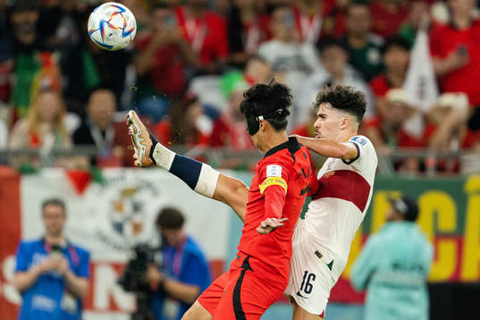Heungmin Son of South Korea and Vitinha of Portugal
