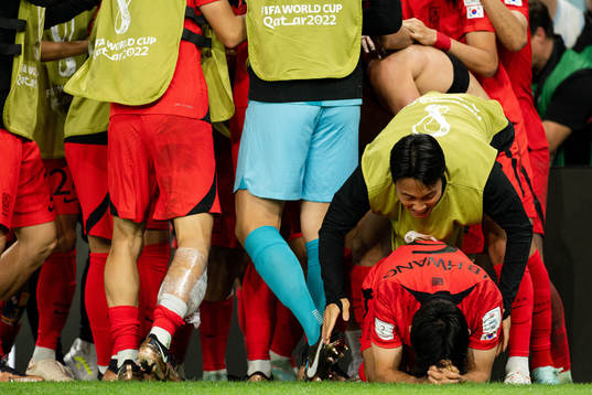 Seungho Paik and Inbeom Hwang of South Korea celebrate the