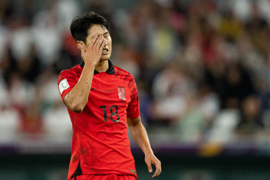 Kangin Lee of South Korea looks dejected