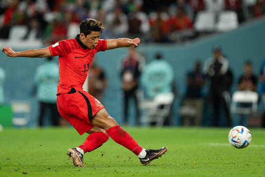 Heechan Hwang of South Korea scores the 2-1 goal
