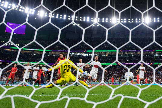 Heechan Hwang of South Korea scores 2-1 behind goalkeeper