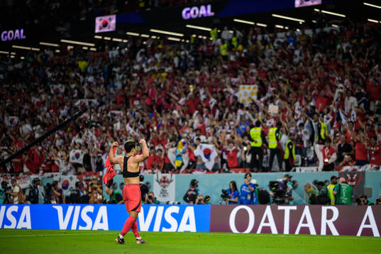 Heechan Hwang of South Korea celebrates his 2-1 goal