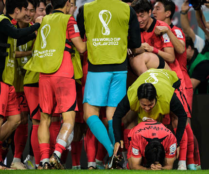 Seungho Paik and Inbeom Hwang of South Korea celebrate the