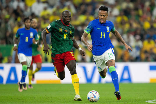 Vincent Aboubakar of Cameroon and Eder Militao of Brazil
