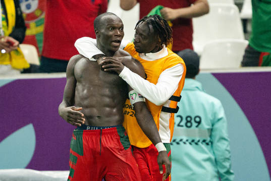 Vincent Aboubakar and Olivier Mbaizo of Cameroon celebrate