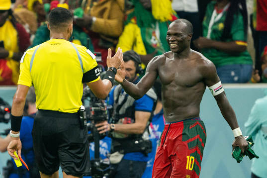 Vincent Aboubakar of Cameroon receives his second yellow
