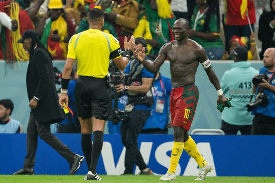 Vincent Aboubakar of Cameroon receives his second yellow