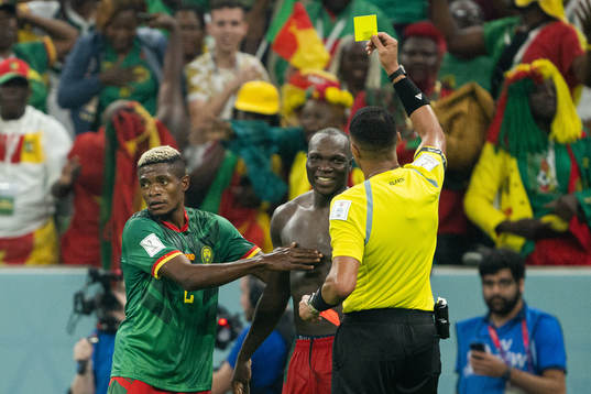 Vincent Aboubakar of Cameroon receives his second yellow