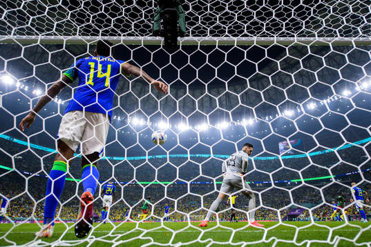 Eder Militao and goalkeeper Ederson of Brazil look  dejected