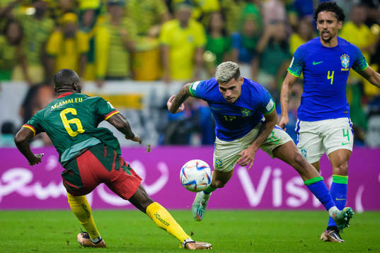 Nicolas Moumi Ngamaleu of Cameroon and Bruno Guimaraes of