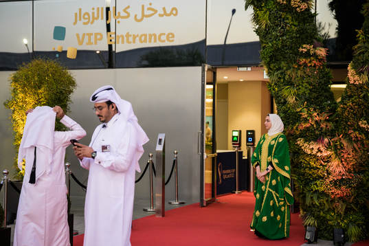 Hosts are standing by a VIP entrance