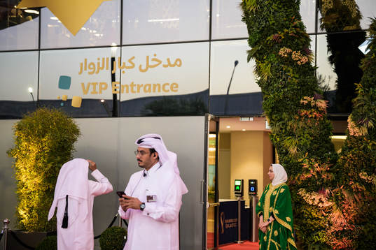 Hosts are standing by a VIP entrance