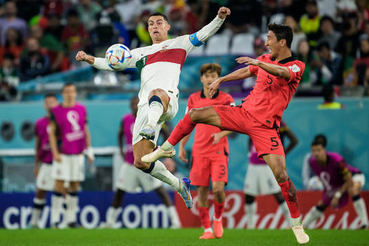 Cristiano Ronaldo of Portugal and Wooyoung Jung of South