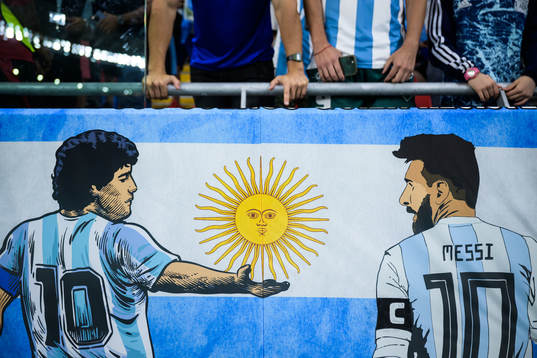 A banner showing Diego Maradona and Lionel Messi of