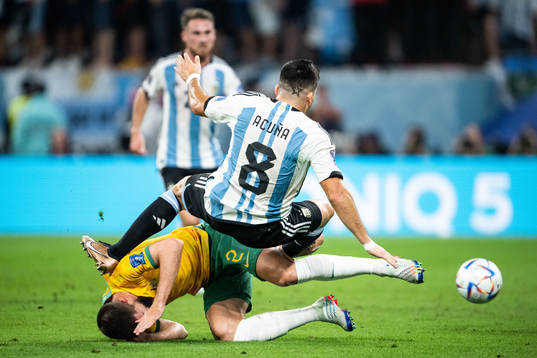 Milos Degenek of Australia and Marcos Acuna of Argentina