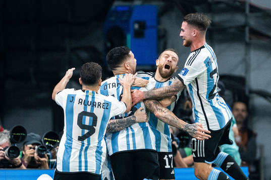 Lionel Messi of Argentina celebrates with Julian Alvarez,