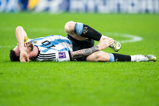 Lionel Messi of Argentina in pain