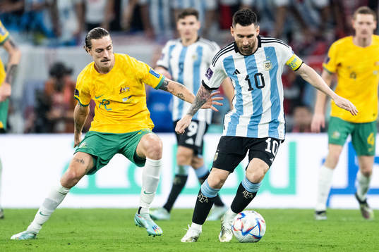 Jackson Irvine of Australia and Lionel Messi of Argentina