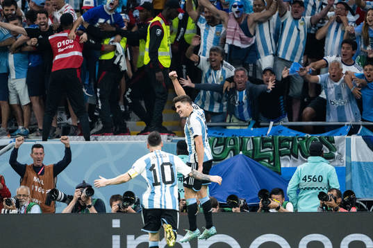 Julian Alvarez of Argentina celebrates with Lionel Messi