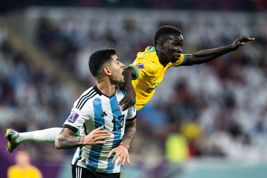 Cristian Romero of Argentina and Garang Kuol of Australia