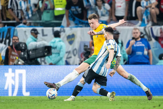 Harry Souttar of Australia and Lionel Messi of Argentina
