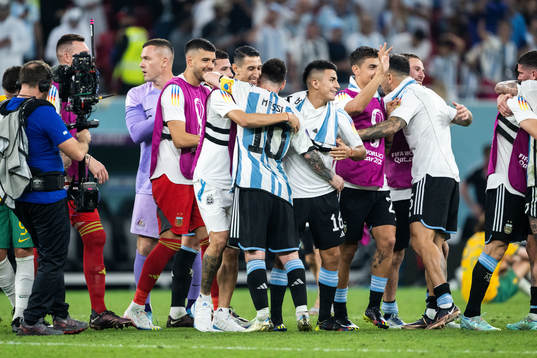 Angel de Maria and Thiago Almada hugs Lionel Messi of